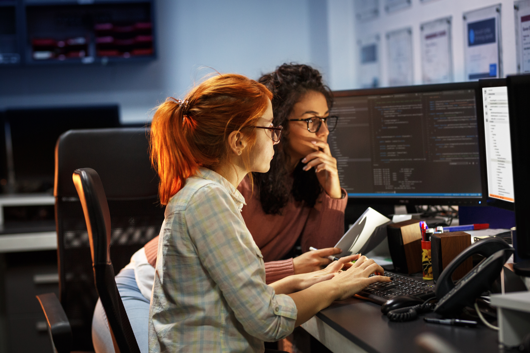 Two girls in front of computer